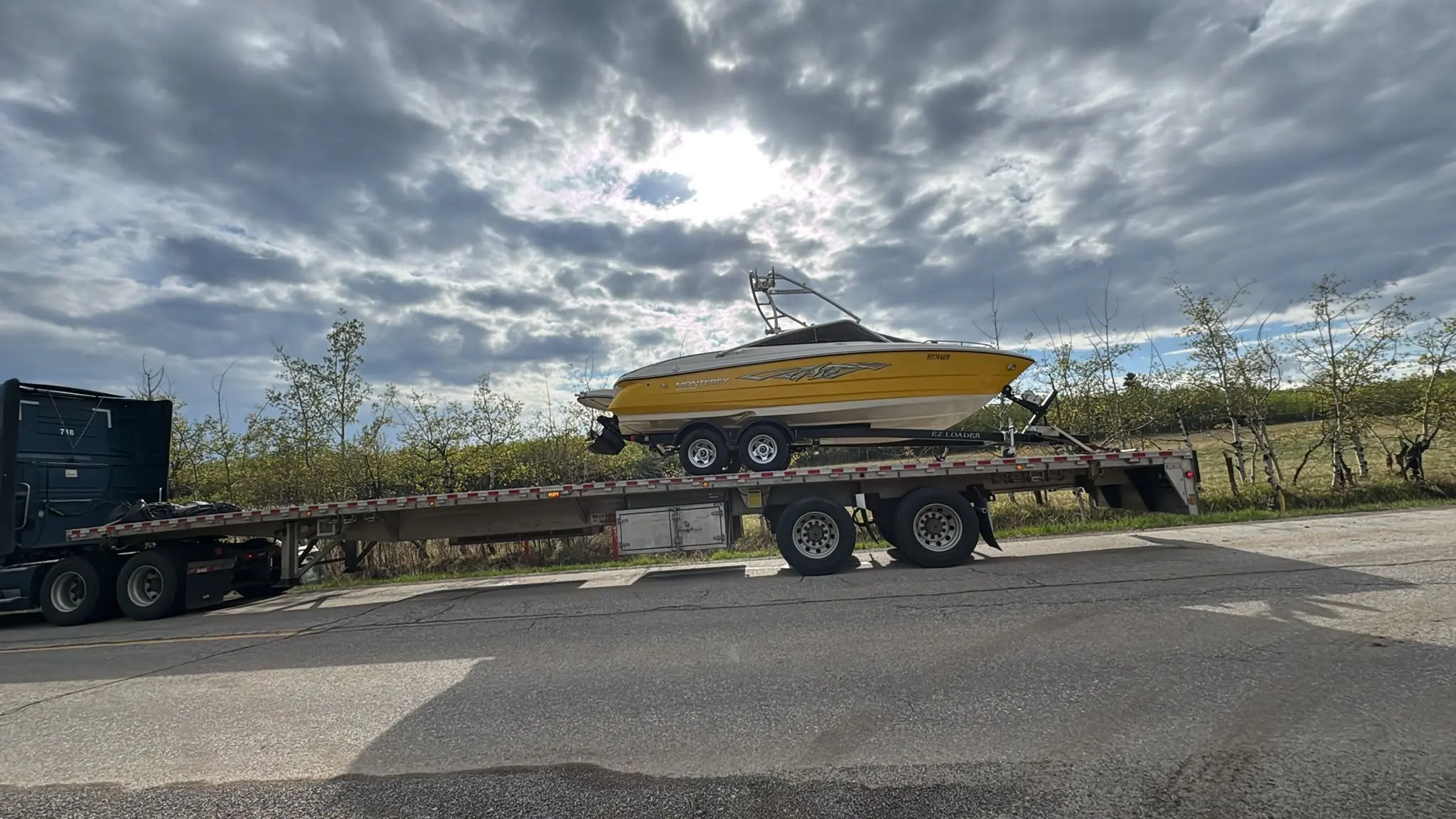 Recreational boat secured on a trailer for ground shipping