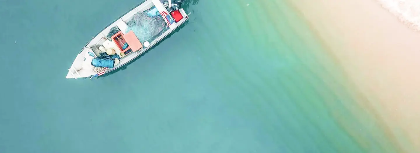 Trailer transporting a small recreational boat overland