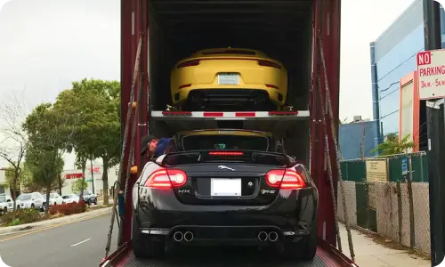 Enclosed trailer transporting a luxury vehicle