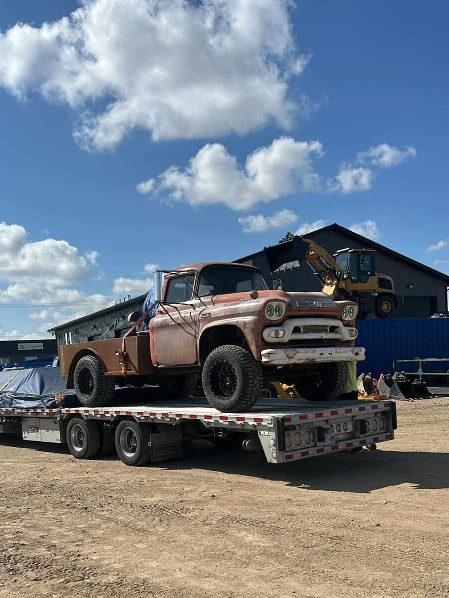 Auto shipping carrier loading vehicles in Manitoba