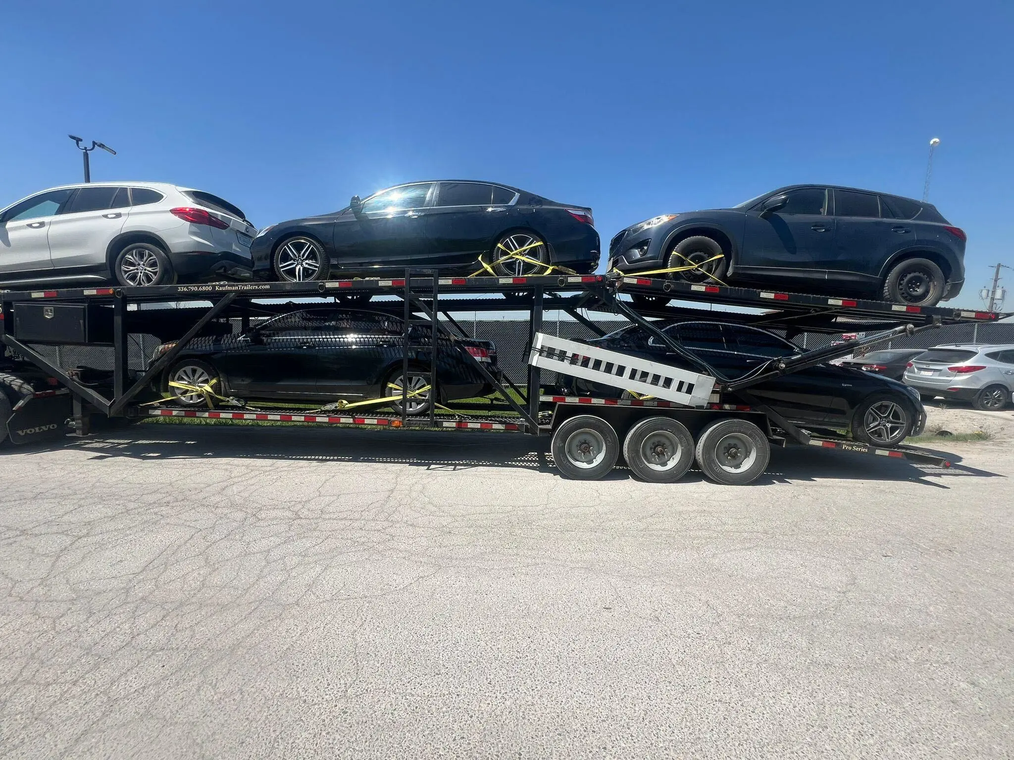 Car shipping in New Brunswick with transport truck driving through a maritime highway