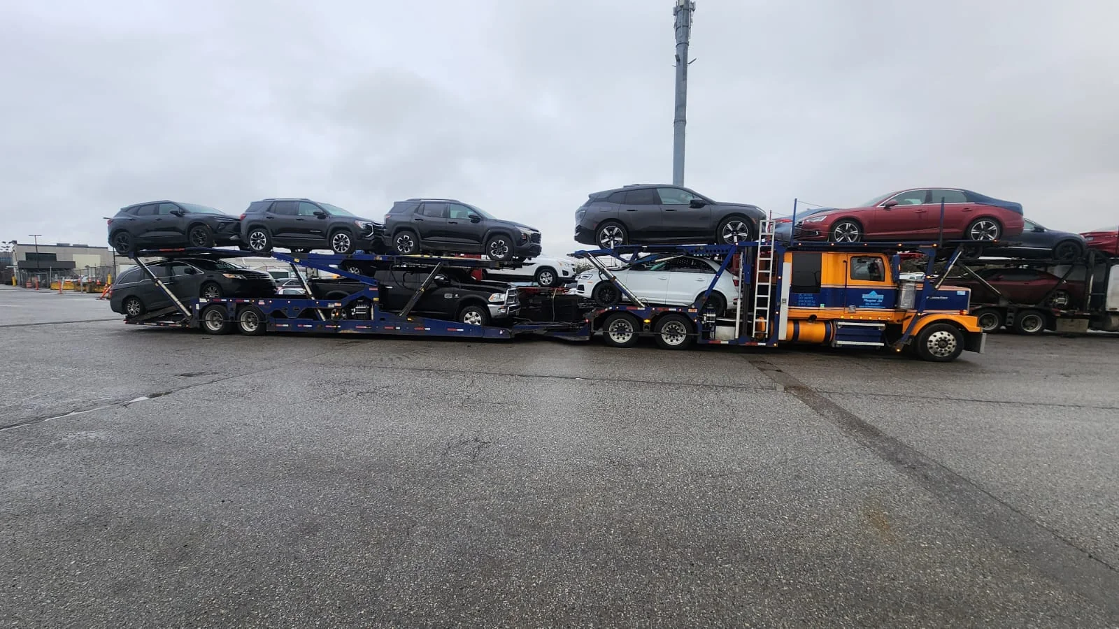Vehicle being transported from Ontario to Alberta on an open carrier