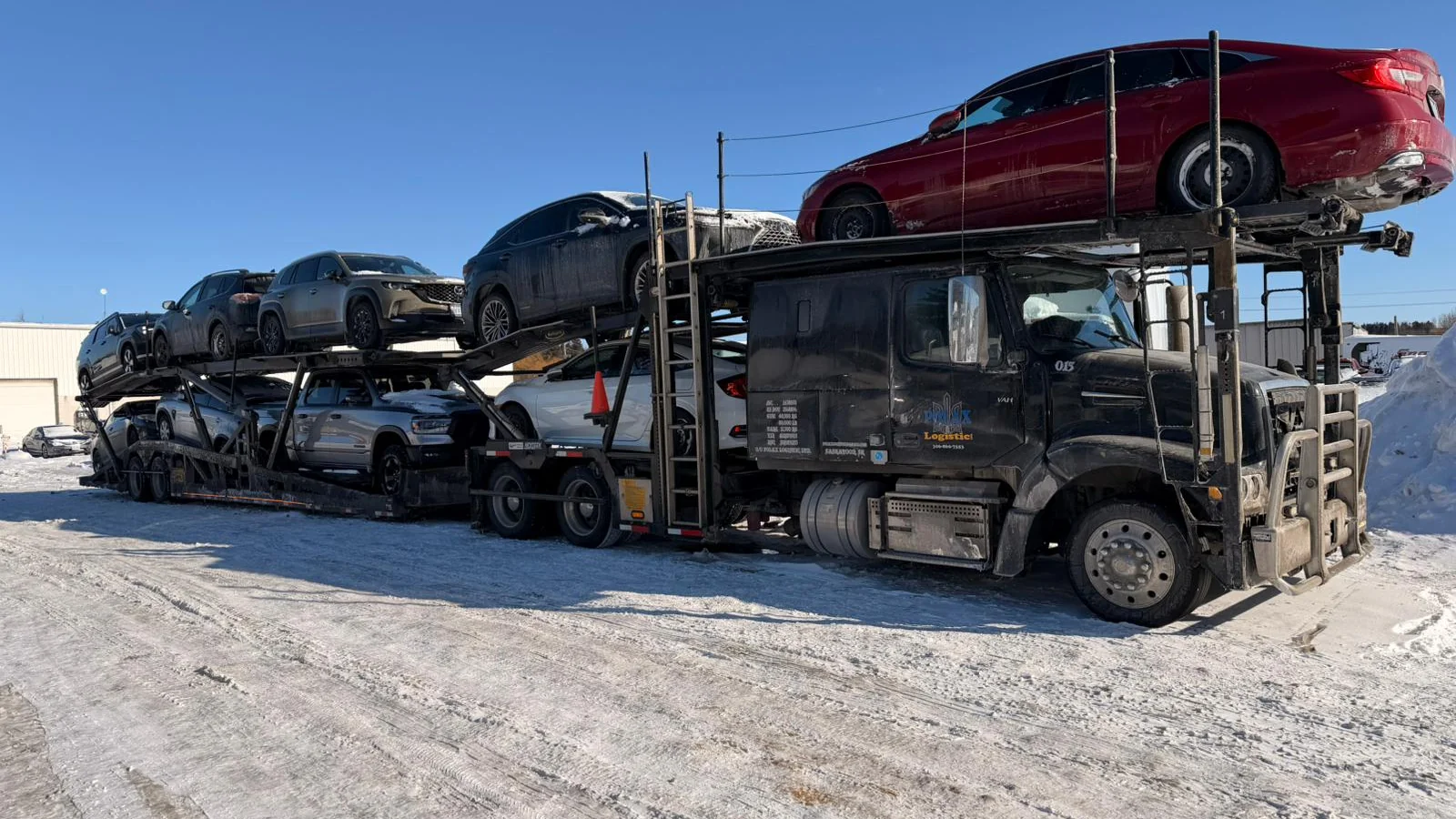 Vehicle being transported from Ontario to the Okanagan on an open carrier