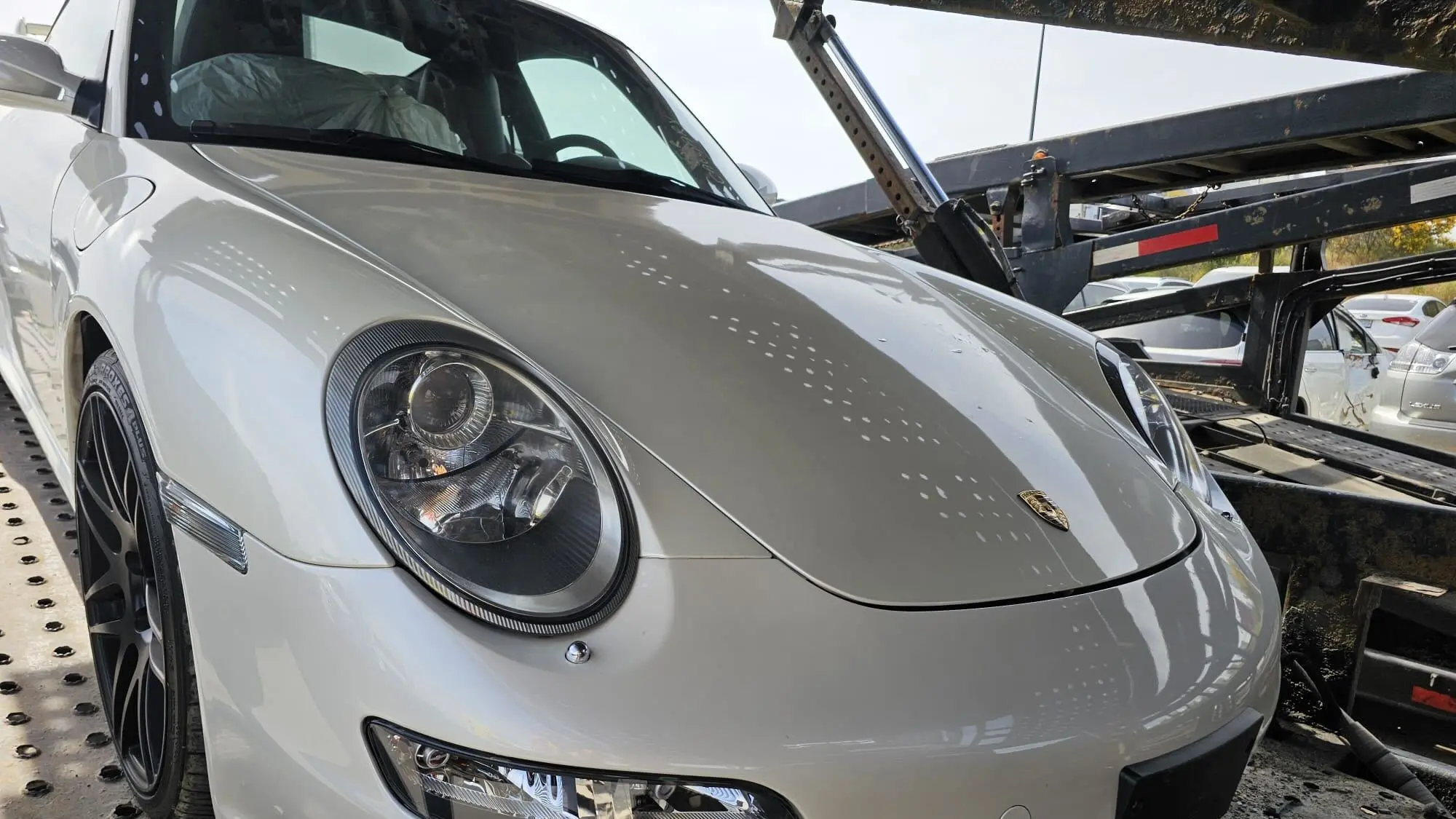 Open car hauler driving cross-country from Calgary