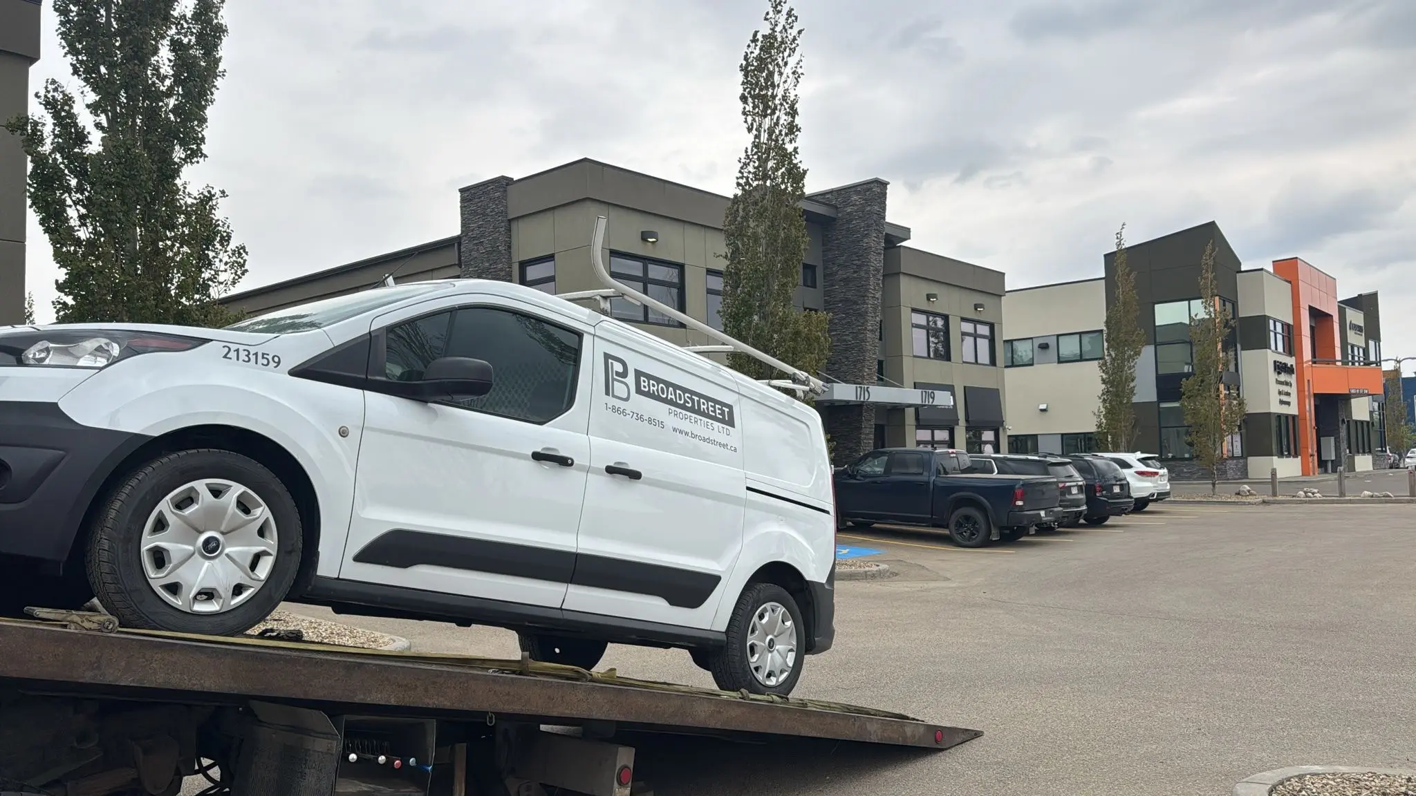 Open car carrier loaded with vehicles traveling from Alberta to Quebec