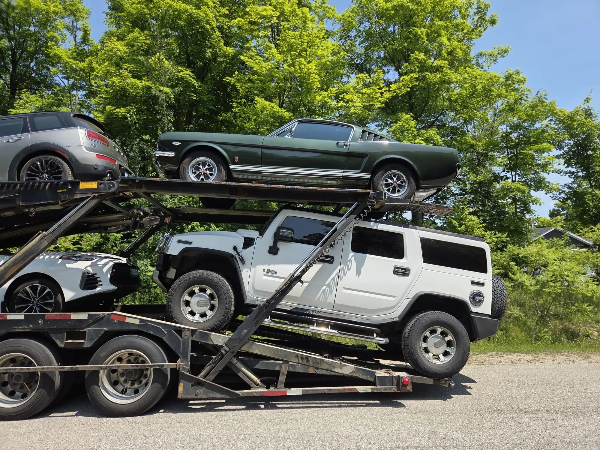 Car carrier truck on road from Calgary to Saskatoon