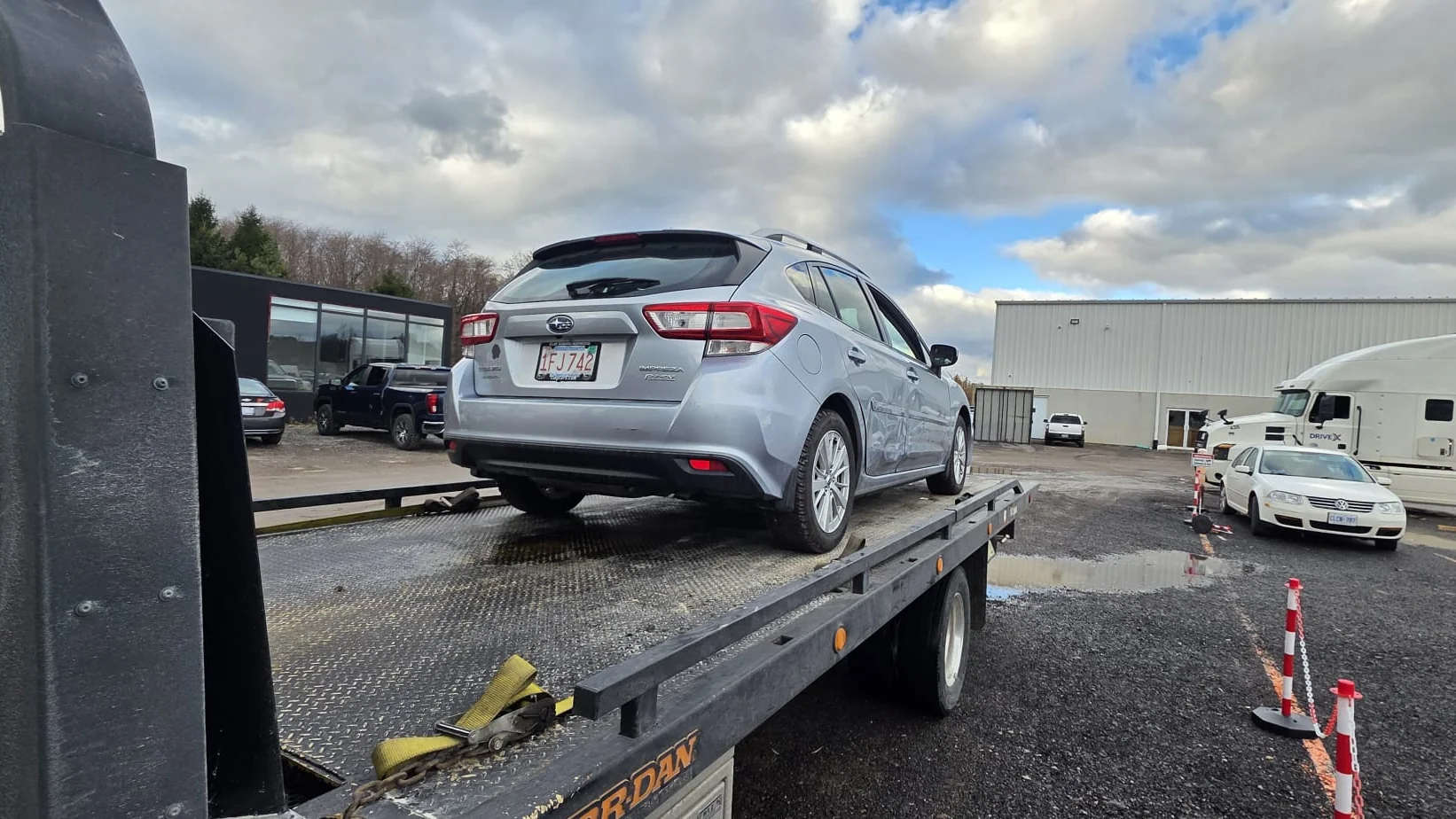 Vehicle being loaded for transport from Calgary to Phoenix