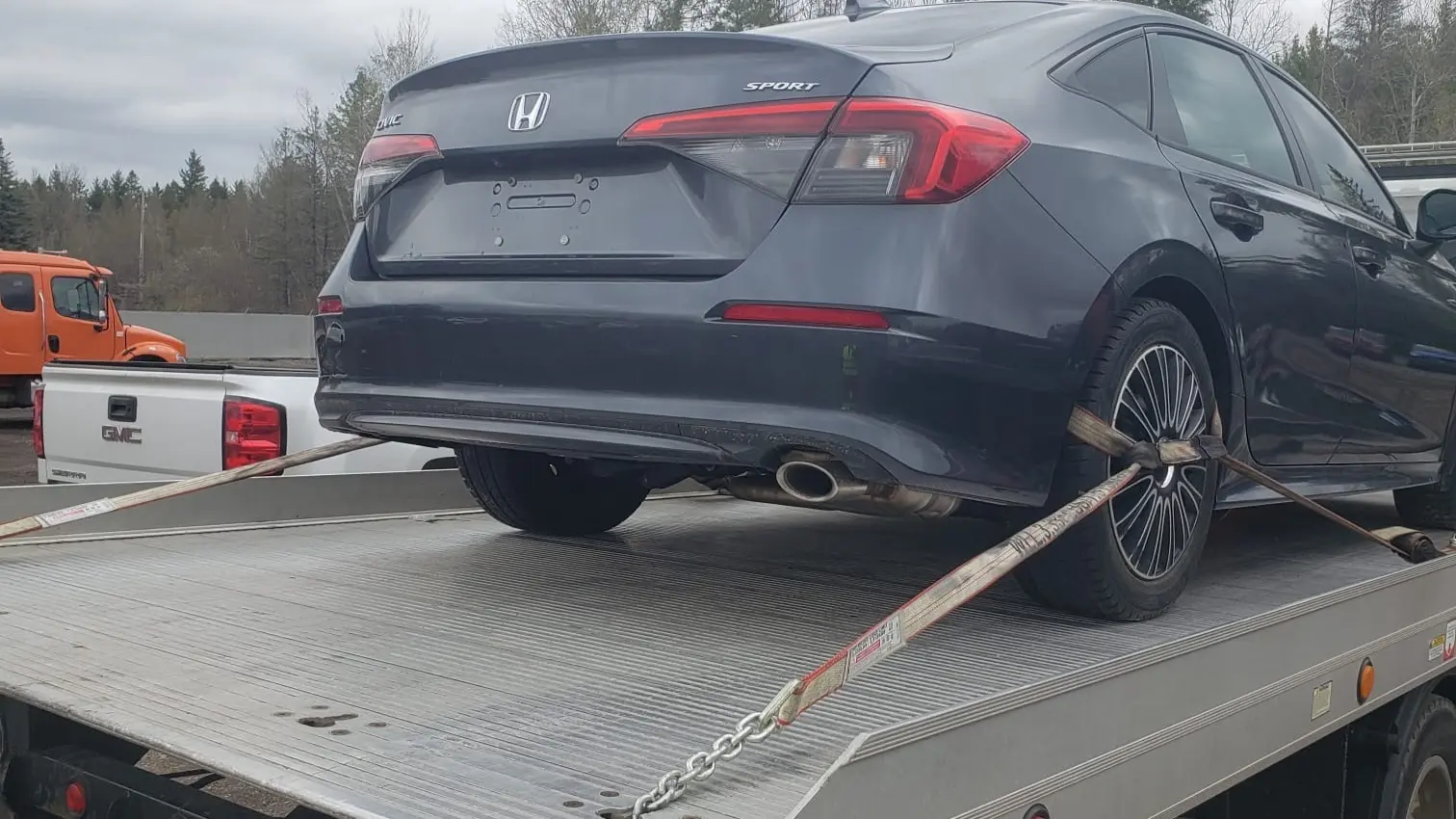 Vehicle being loaded for transport from Halifax to Dallas