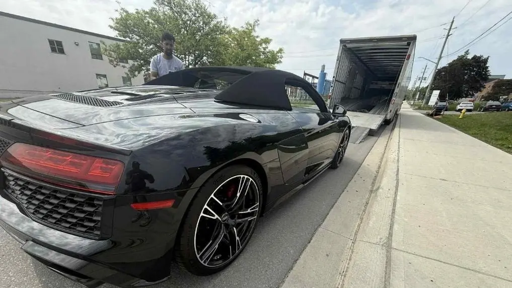 Multi-car hauler driving across Canada
