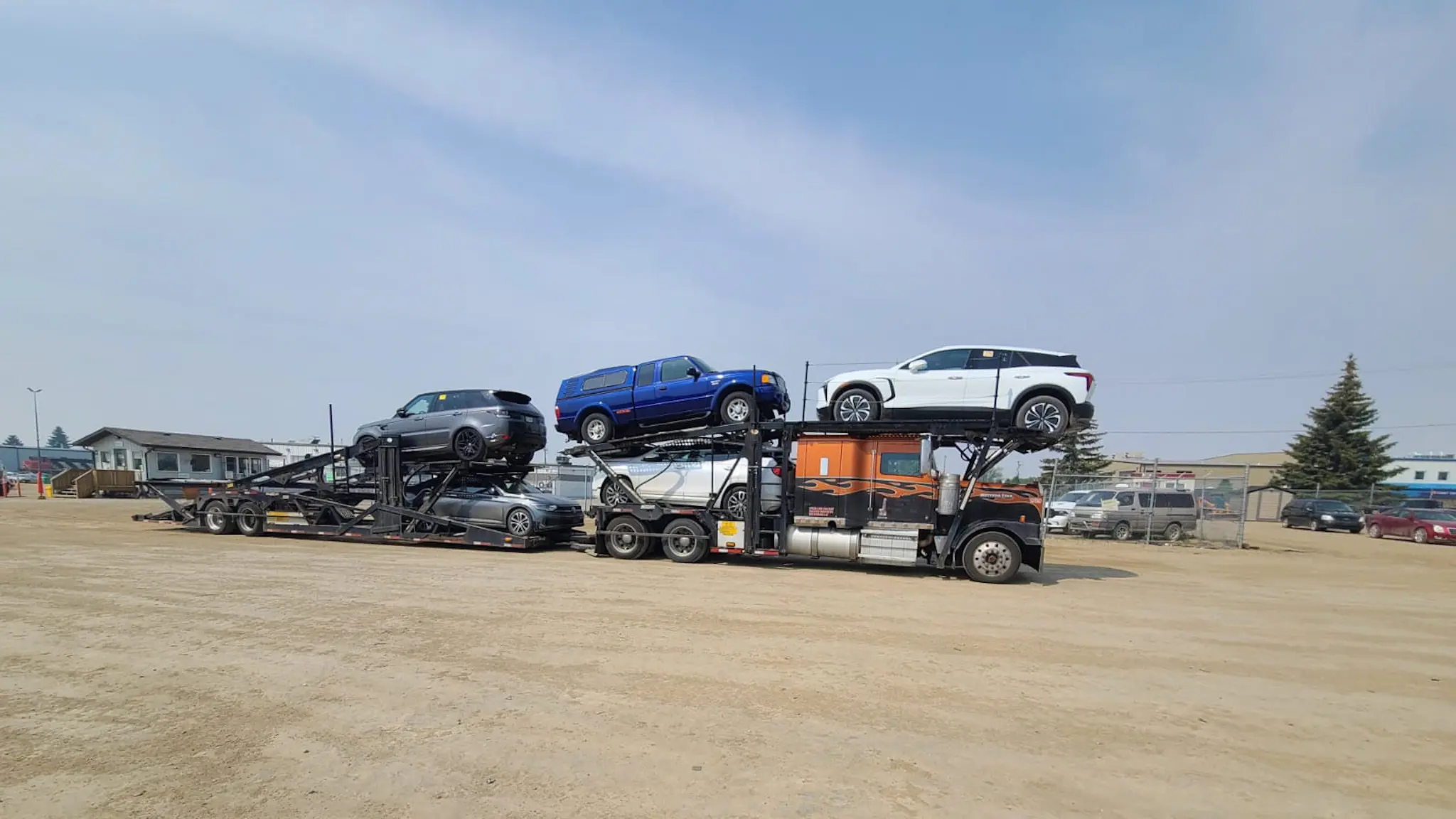 Car transport truck driving near Montreal skyline