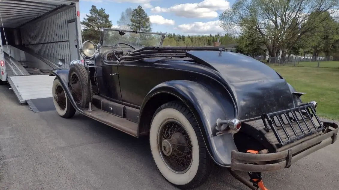 Car hauler driving through Ontario