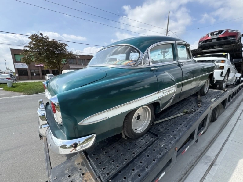 Vehicle being loaded for transport from Surrey to Edmonton