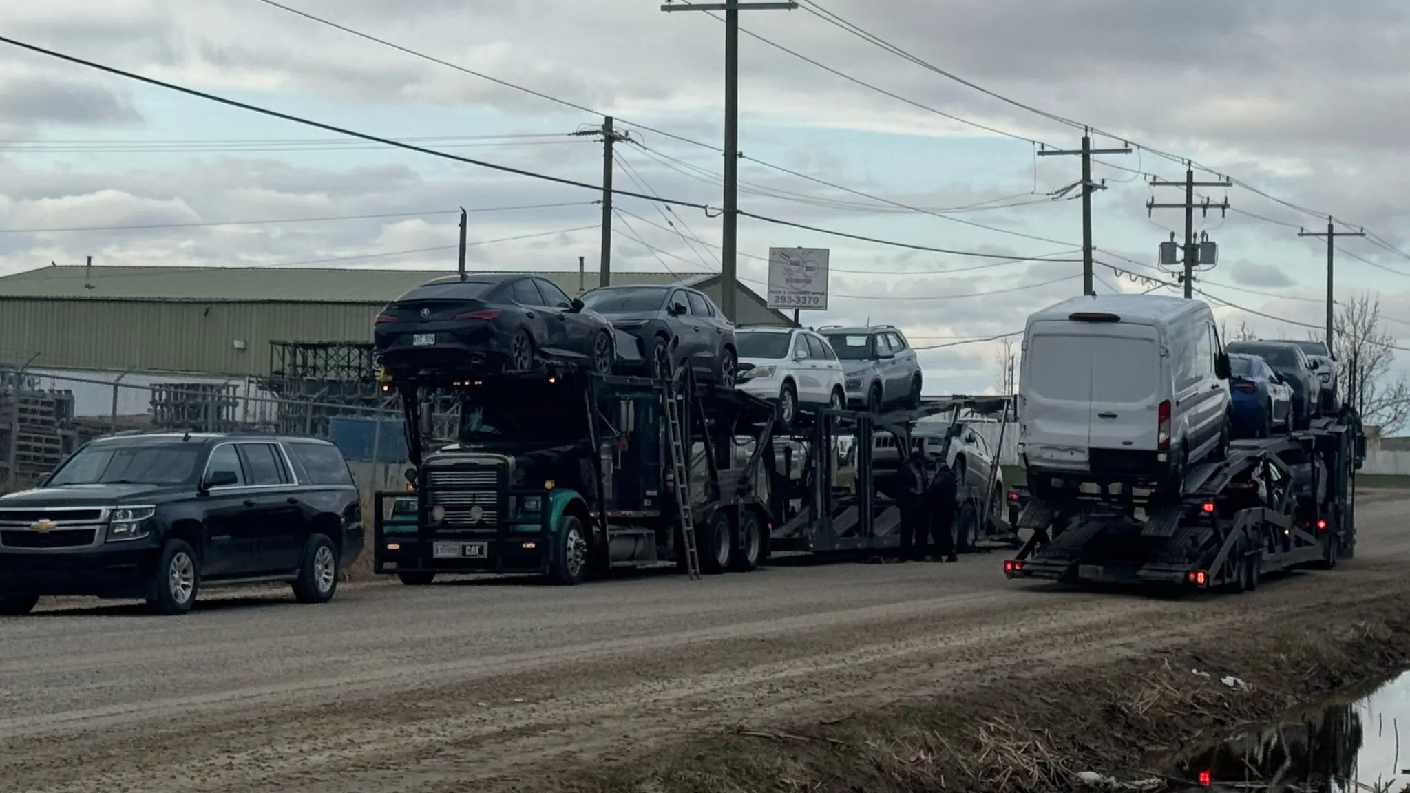 Transport truck hauling cars from Toronto to Vancouver