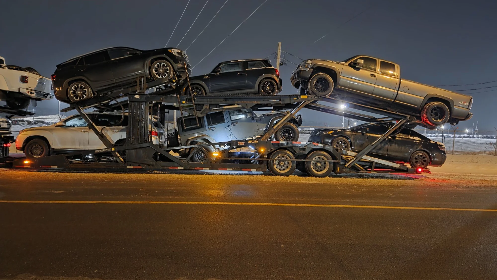 Vehicle being loaded for transport from Vaughan to Regina
