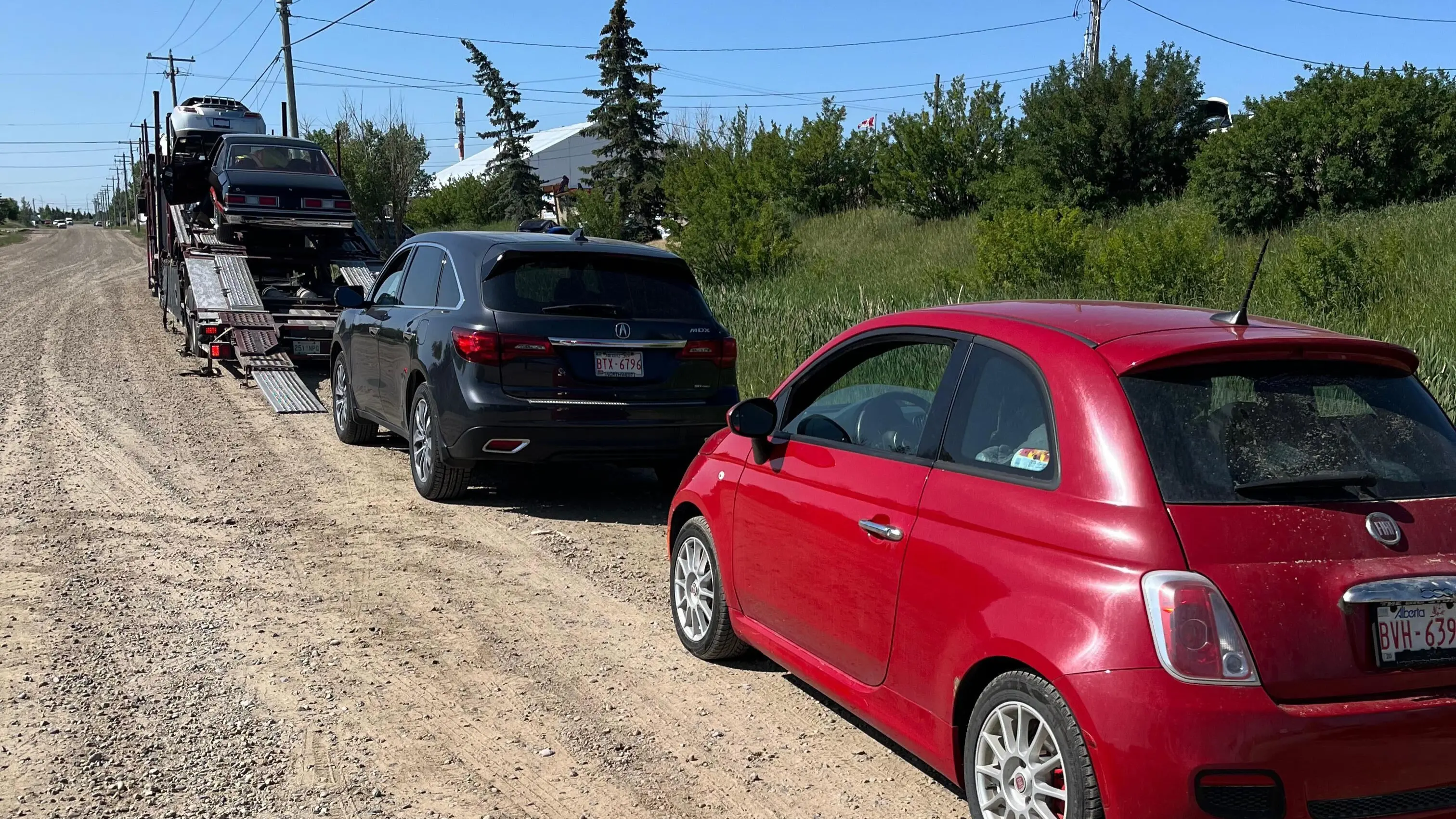 Vehicle being loaded for transport from Winnipeg to Houston