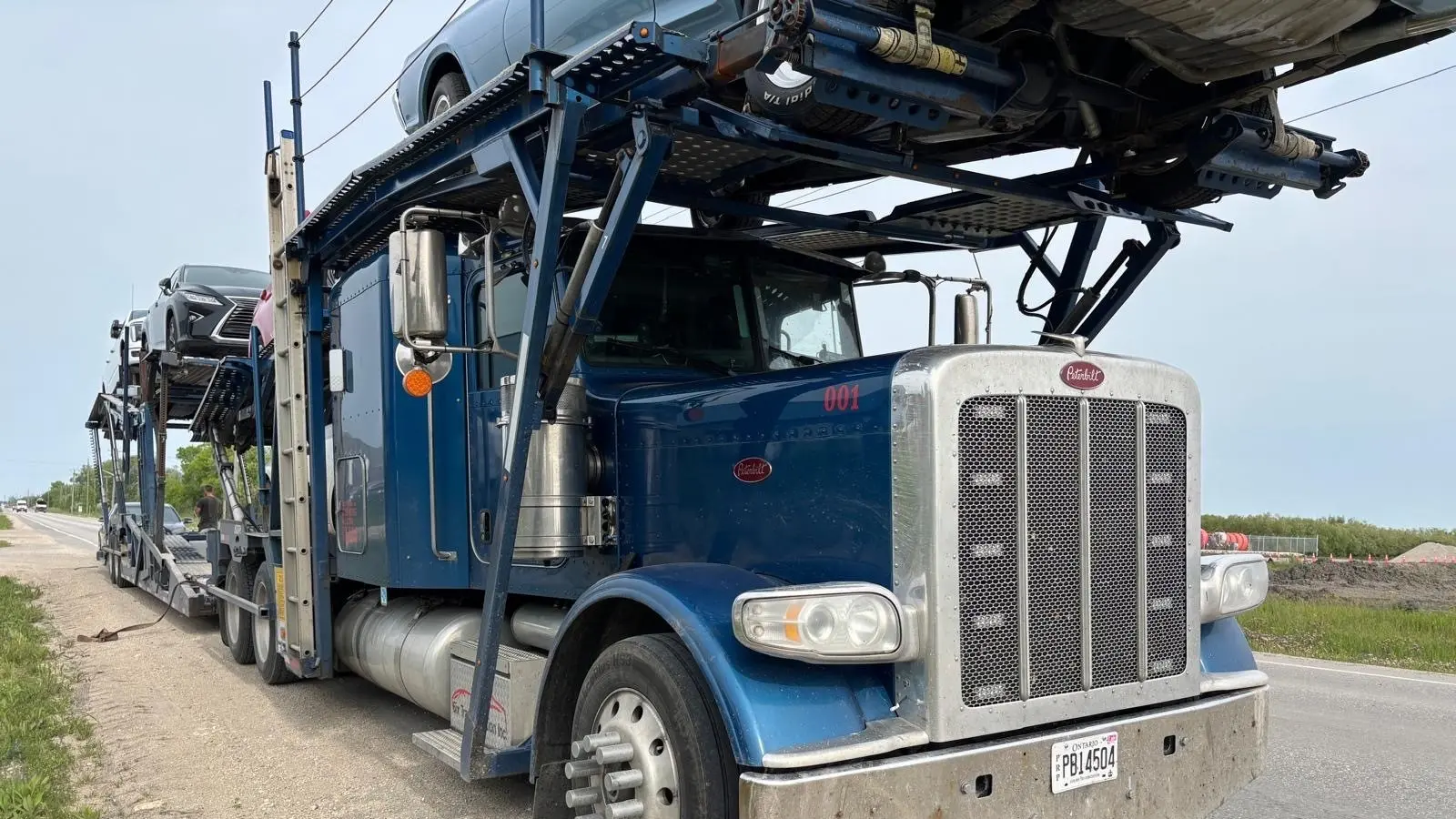 Vehicle being loaded for transport from Winnipeg to Hamilton